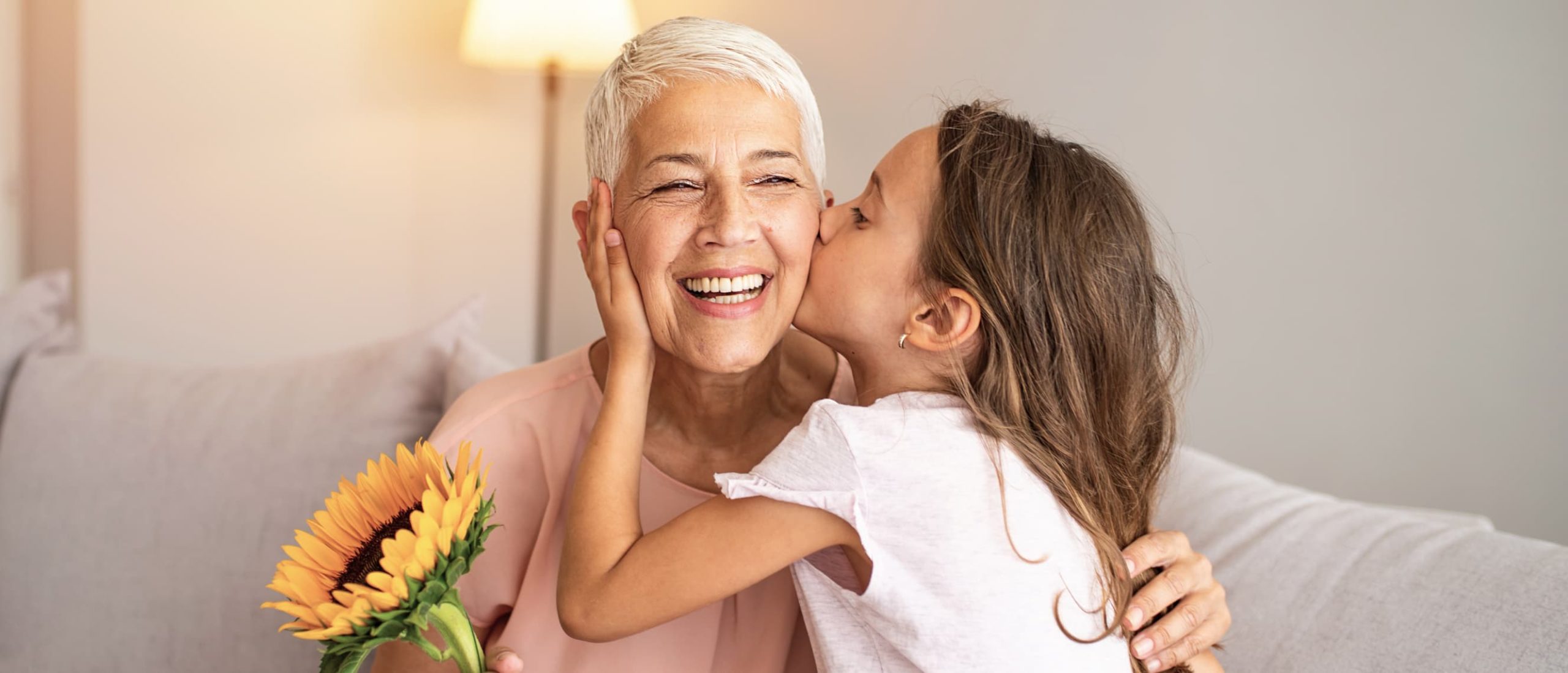 Child kissing a woman